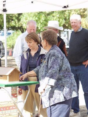 Madelene Lyon (right) shows State Parks Director Ruth Coleman a model of the education pavilion at A Wild Affair in Your Park on Saturday, Oct. 4, 2008. Photo by Elizabeth Larson.